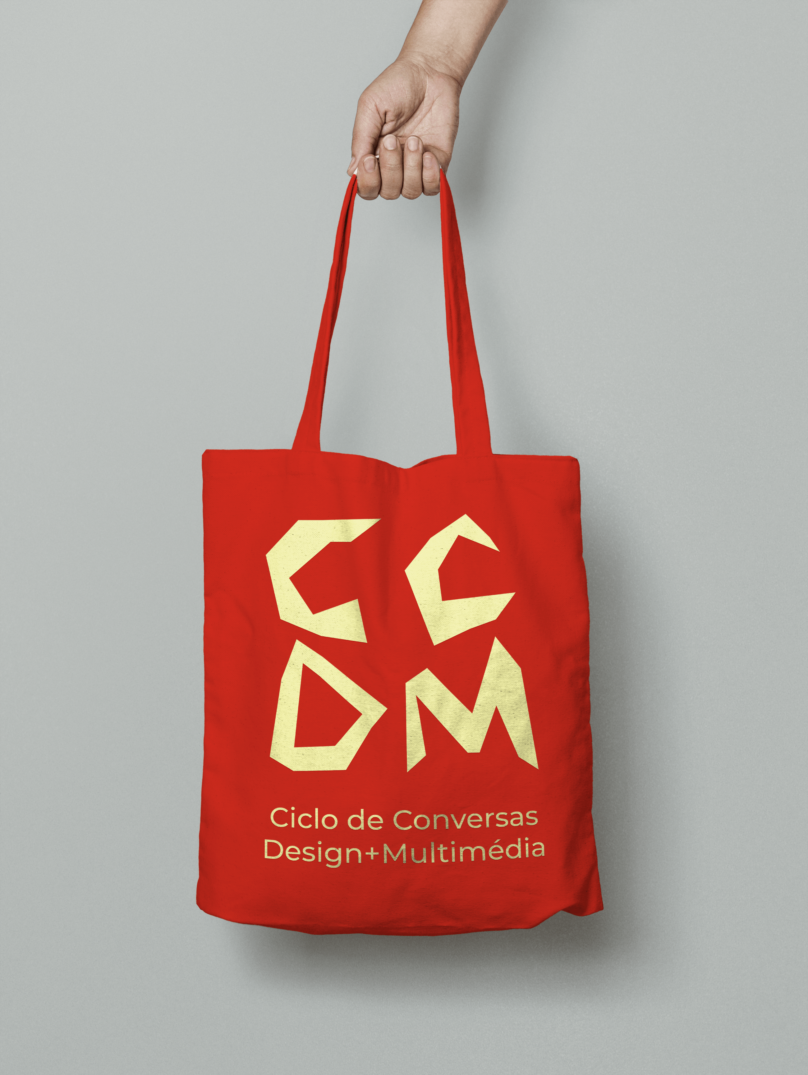 Red and yellow totebag with CCDM's logo.